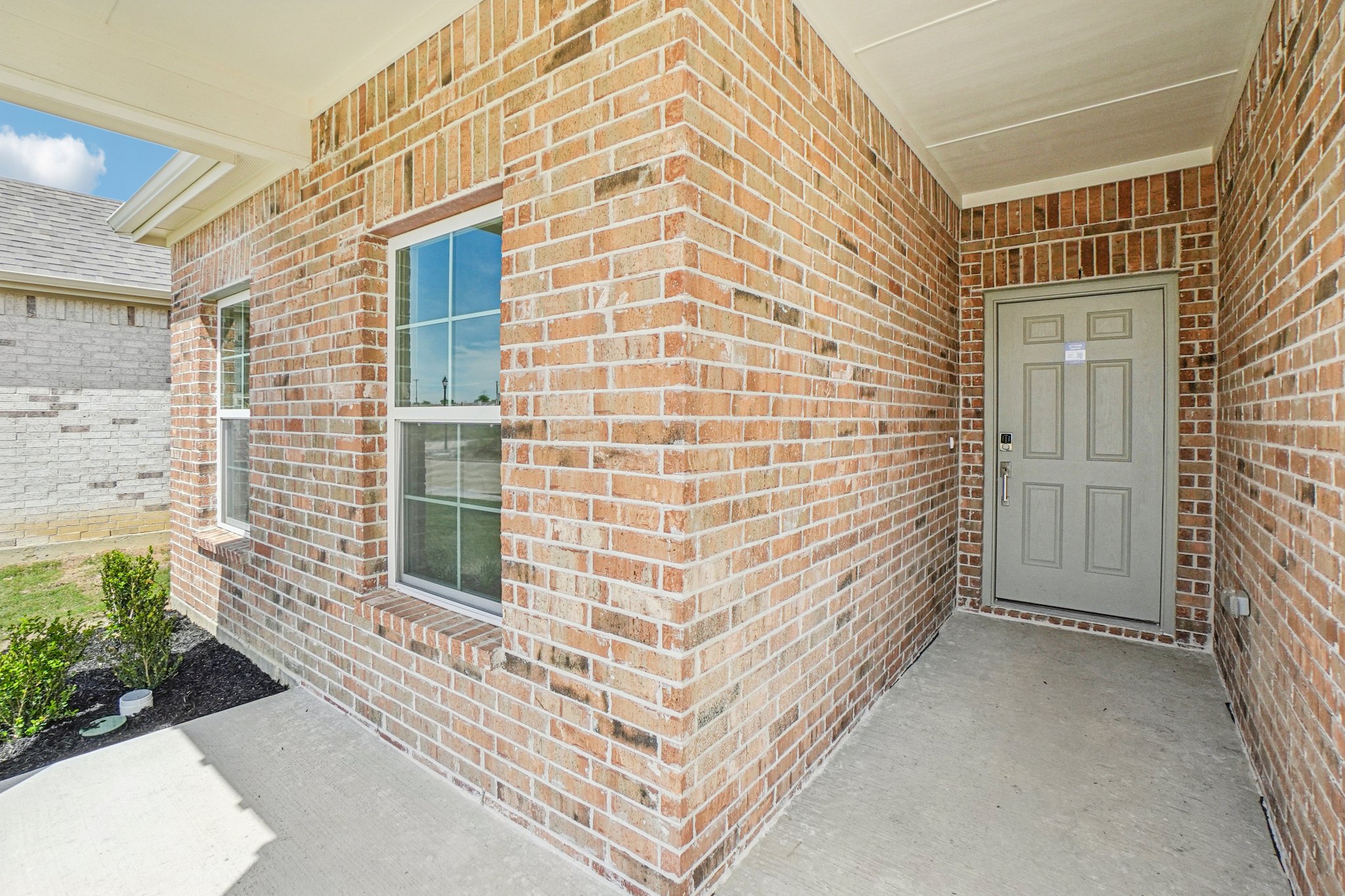 A brick building with a door.