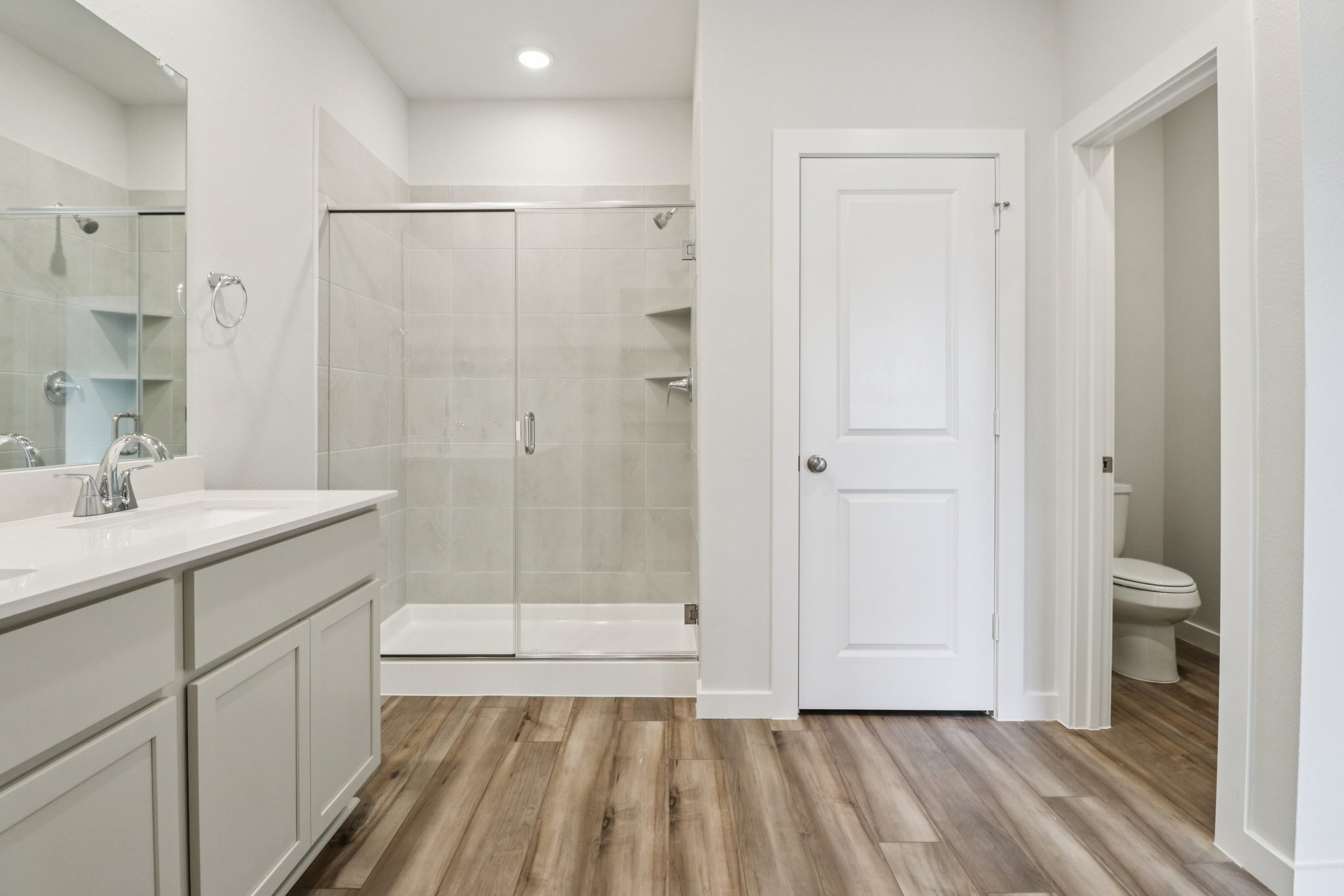 A bathroom with a glass shower.
