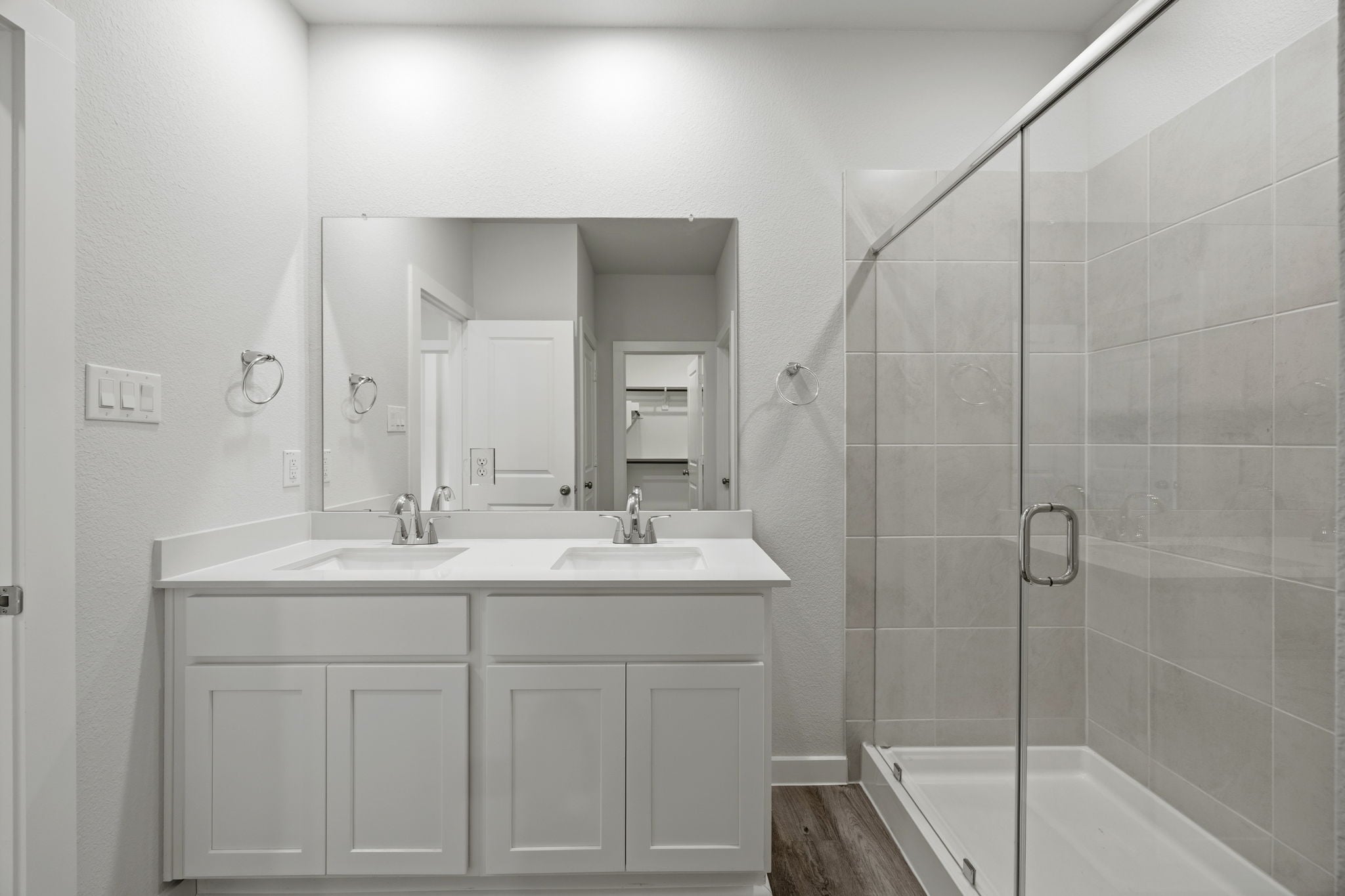 A bathroom with a glass shower.