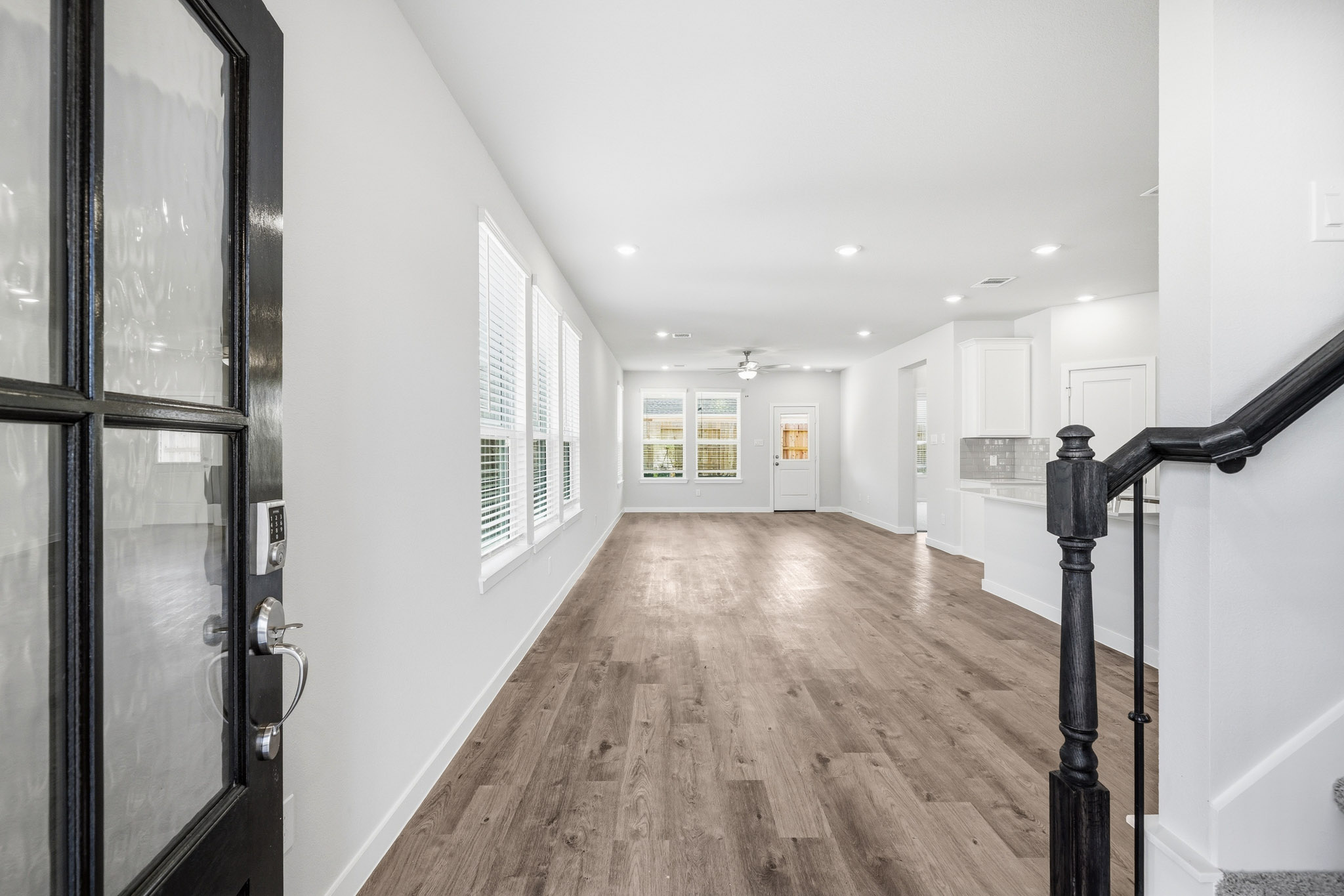 A hallway with glass doors.