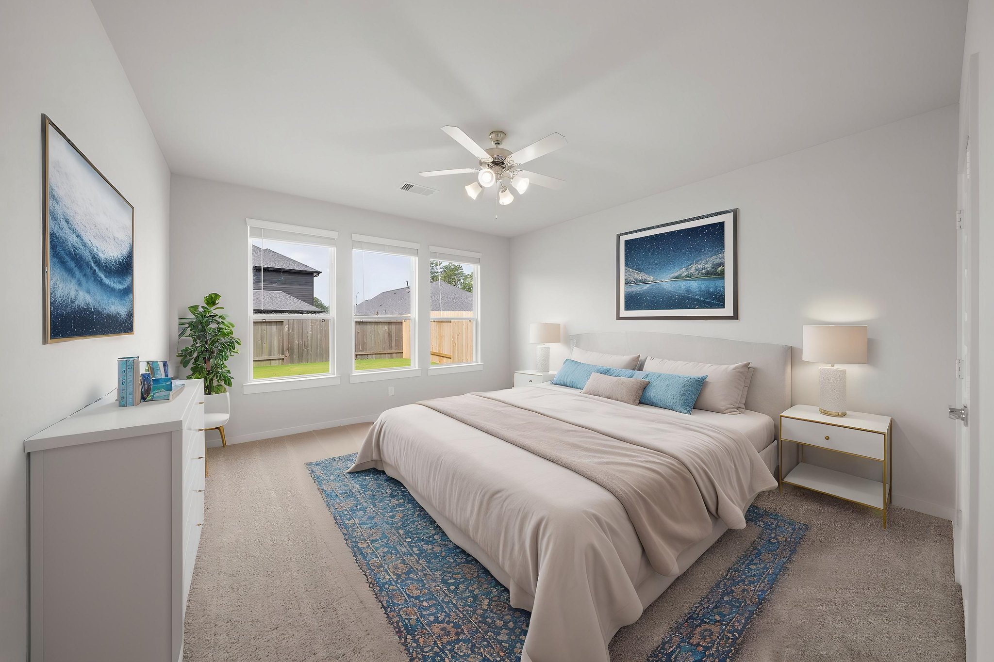 A bedroom with a bed and a fan.