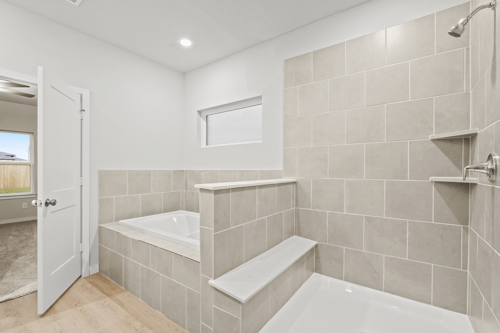 A bathroom with a tub and sink.