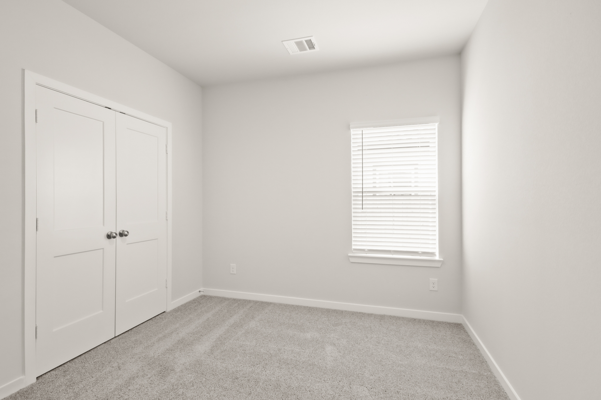 A room with white doors.