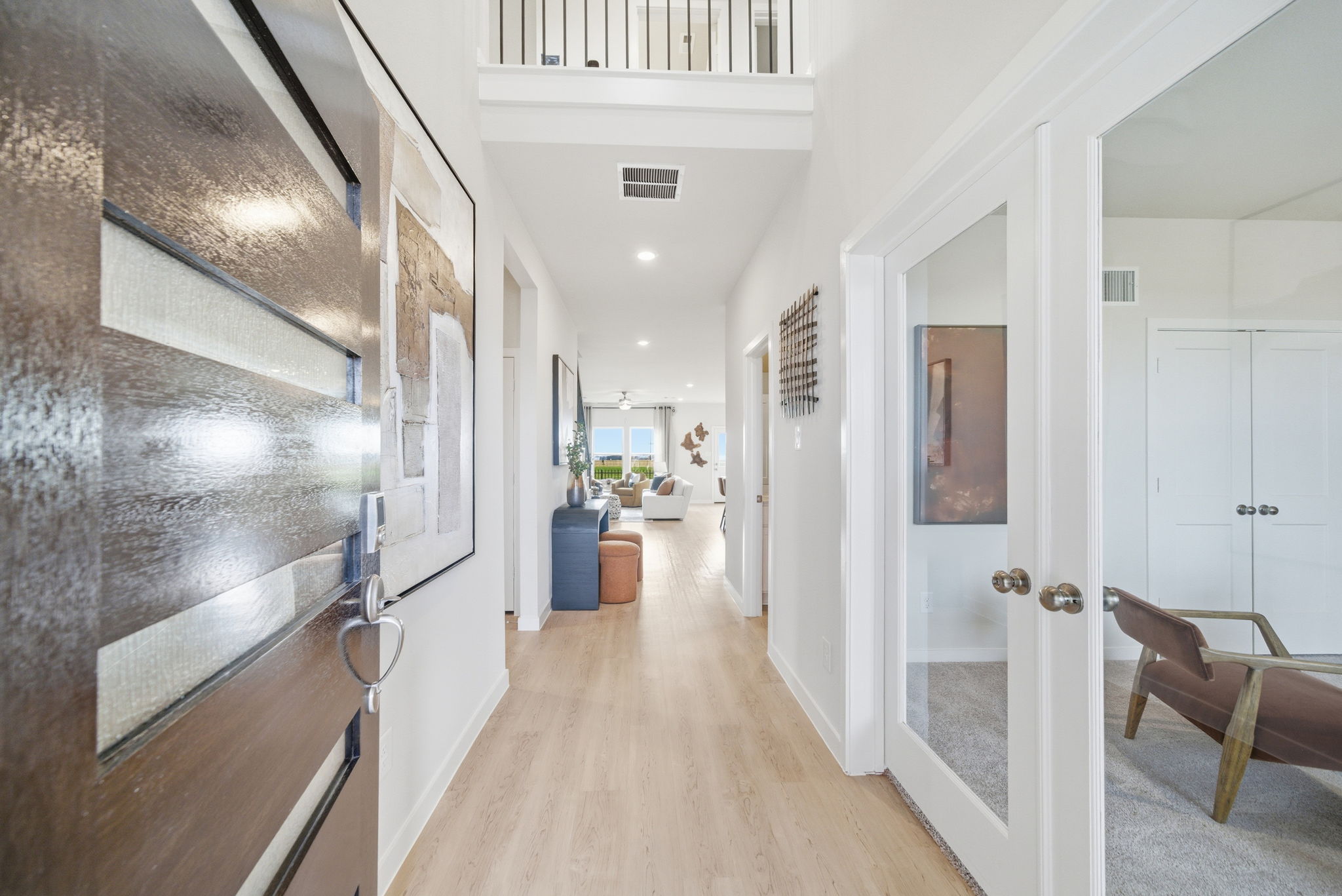 A hallway with white doors.