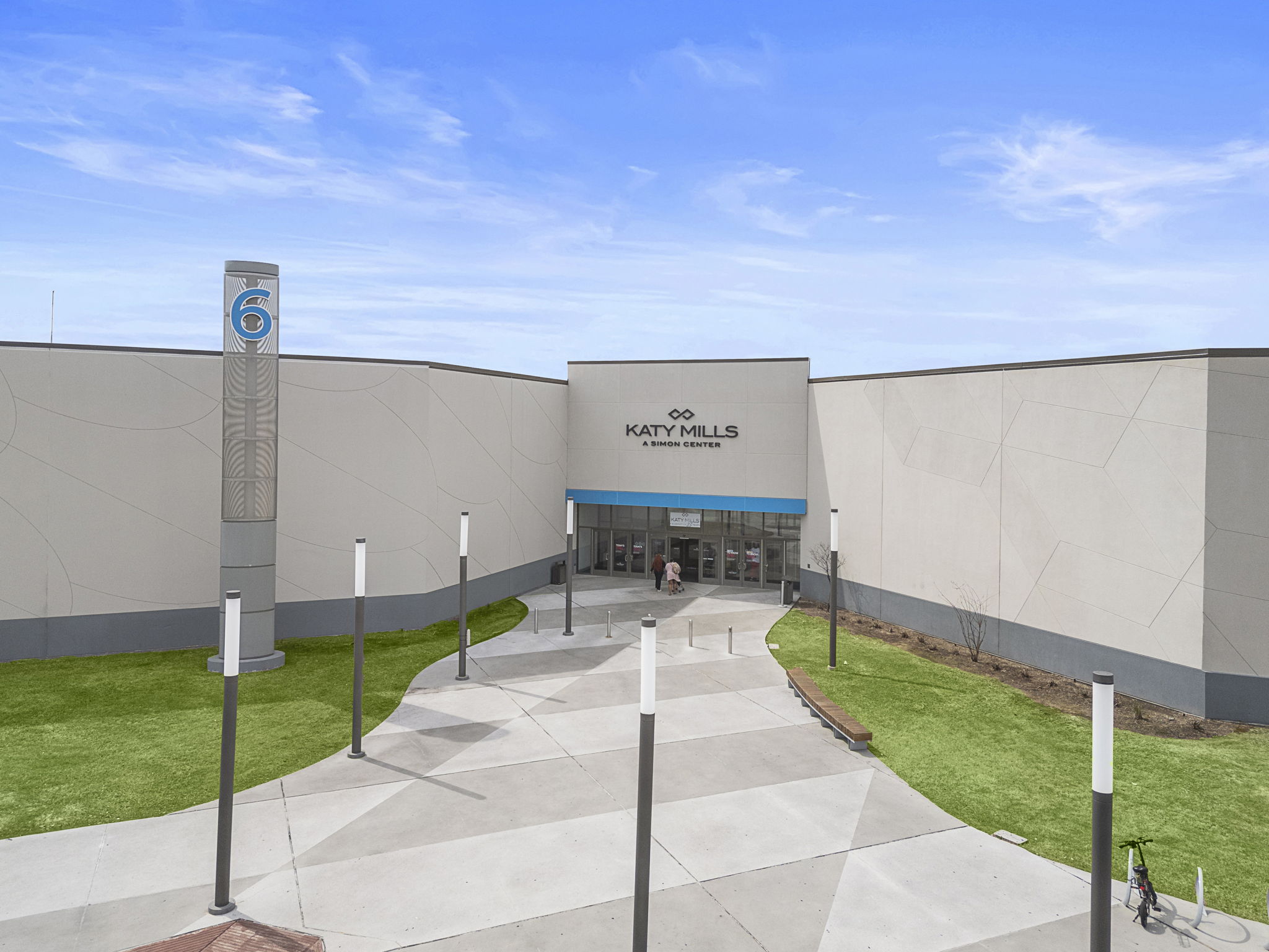 A building with a sign in front.