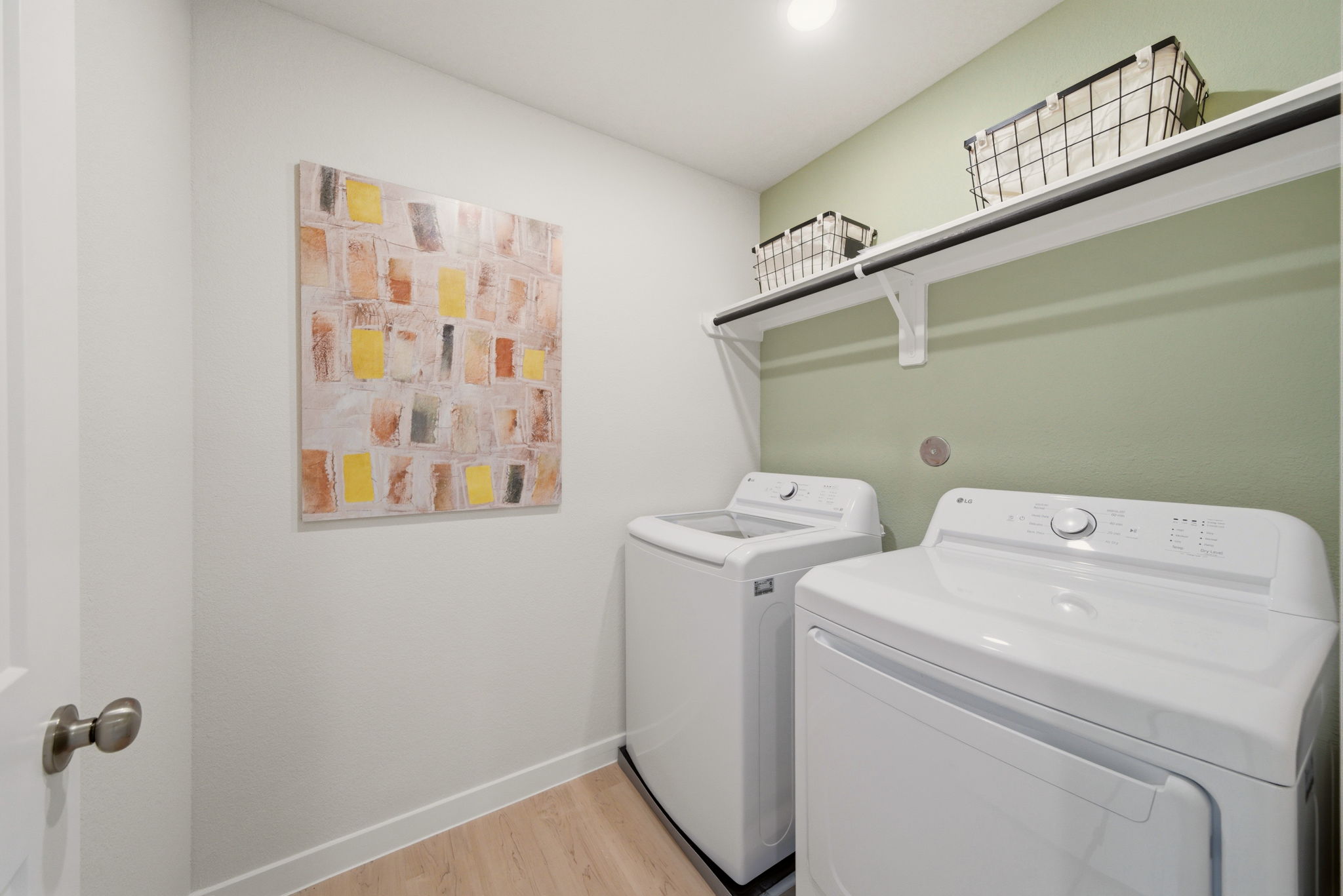 A laundry room with a washer and dryer.
