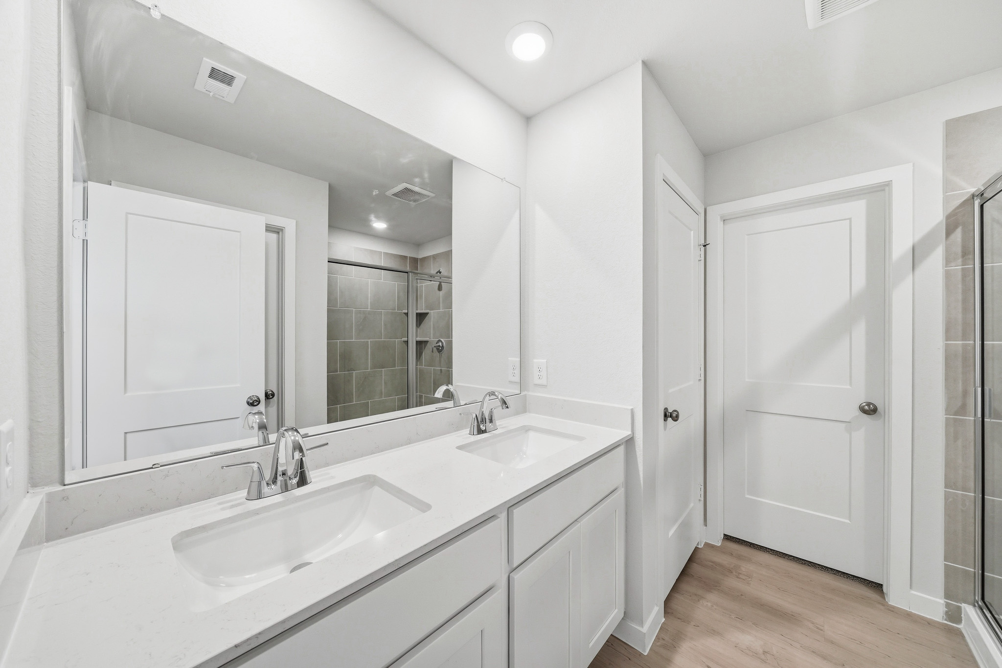 A bathroom with two sinks.