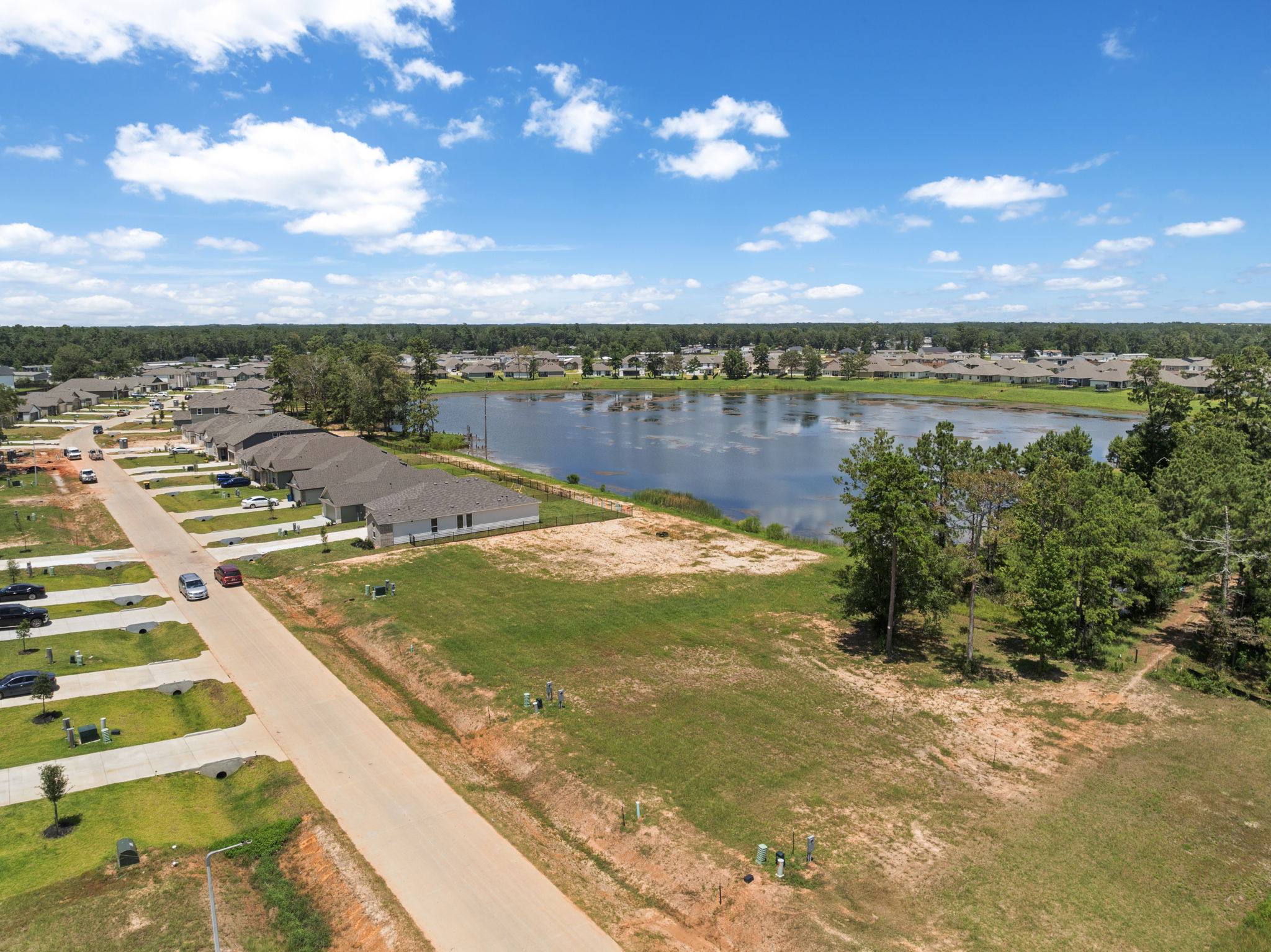 A river with a road and trees.
