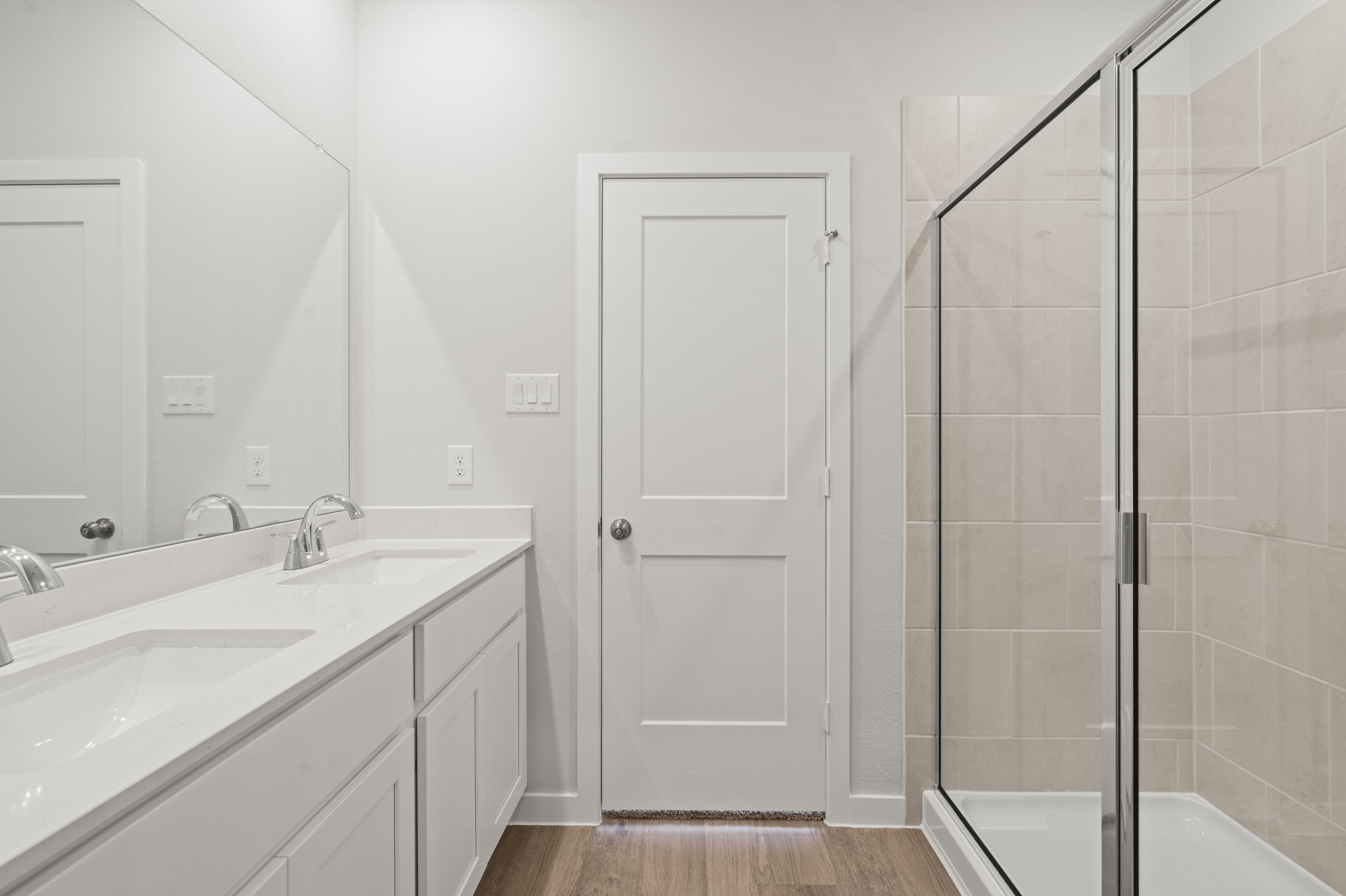 A bathroom with a glass shower.