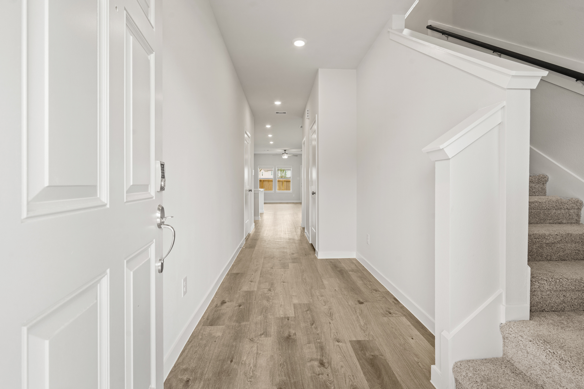 A hallway with white doors.