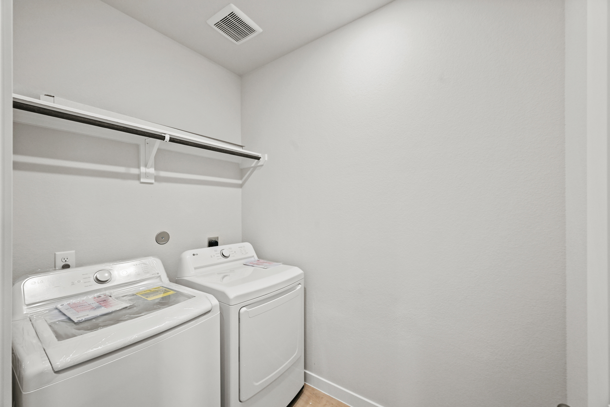 A washing machine in a room.