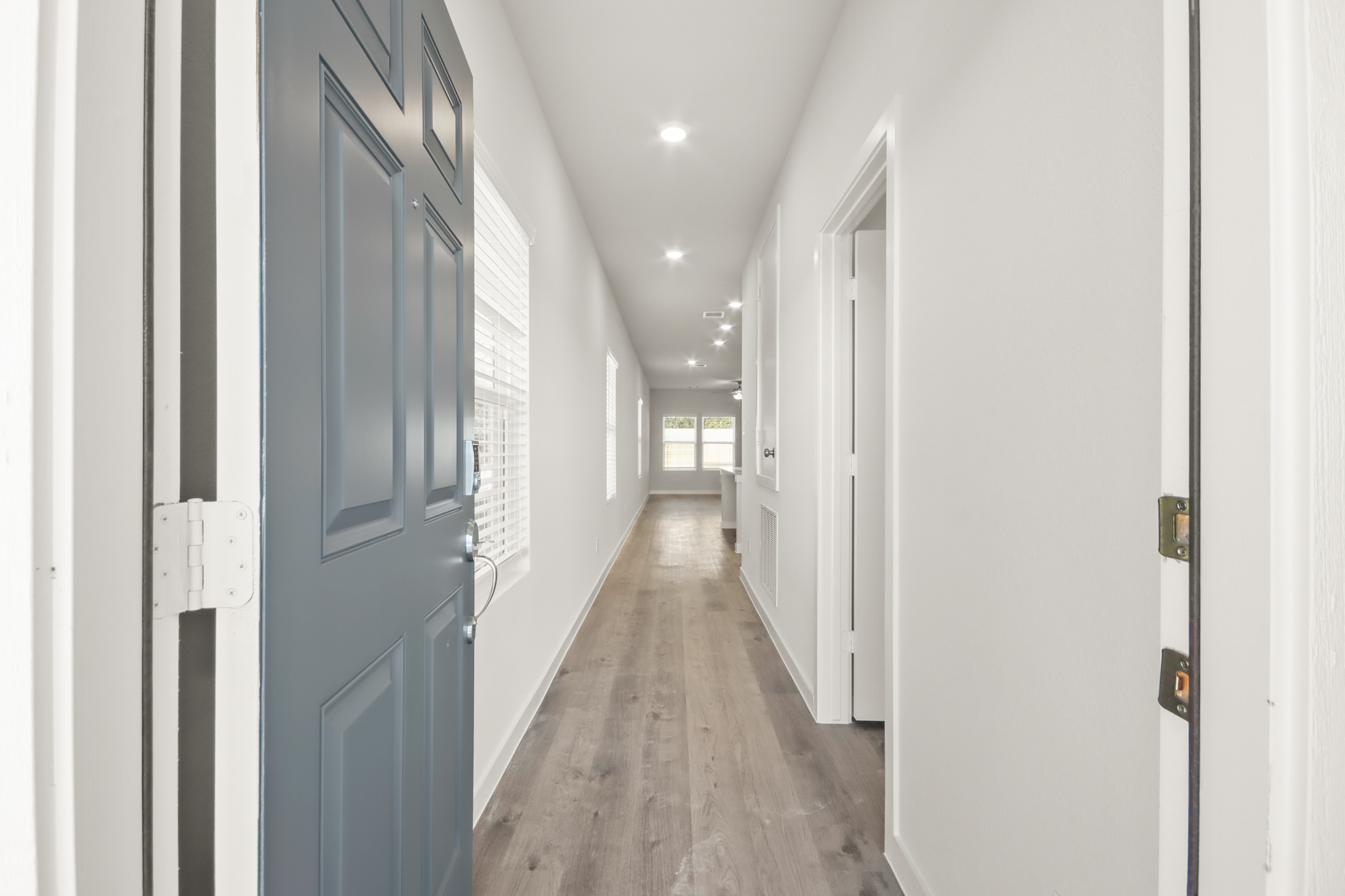 A hallway with blue doors.
