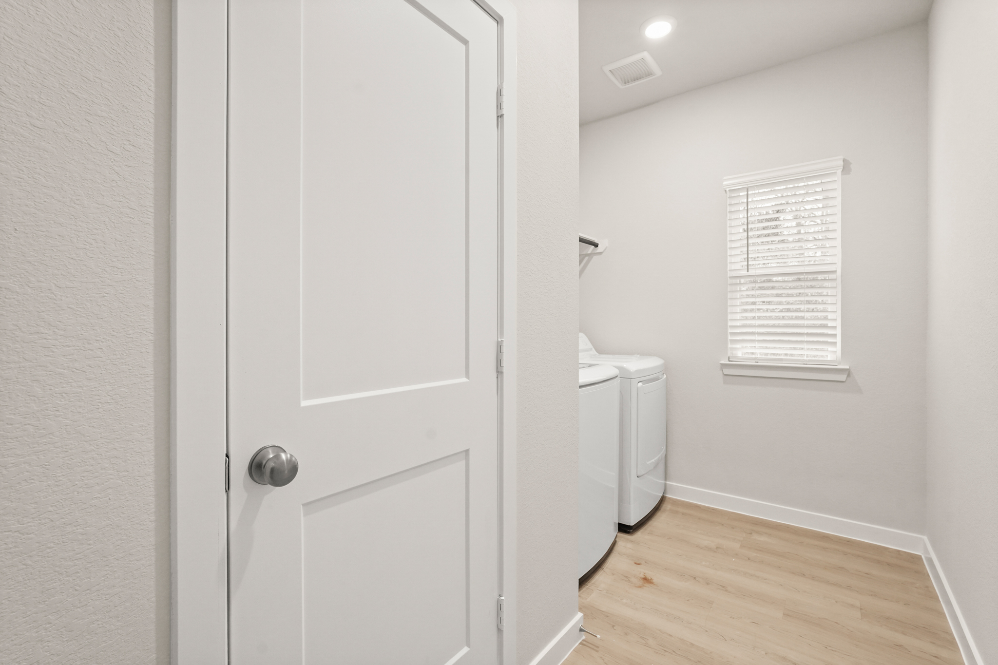A bathroom with a toilet and a sink.