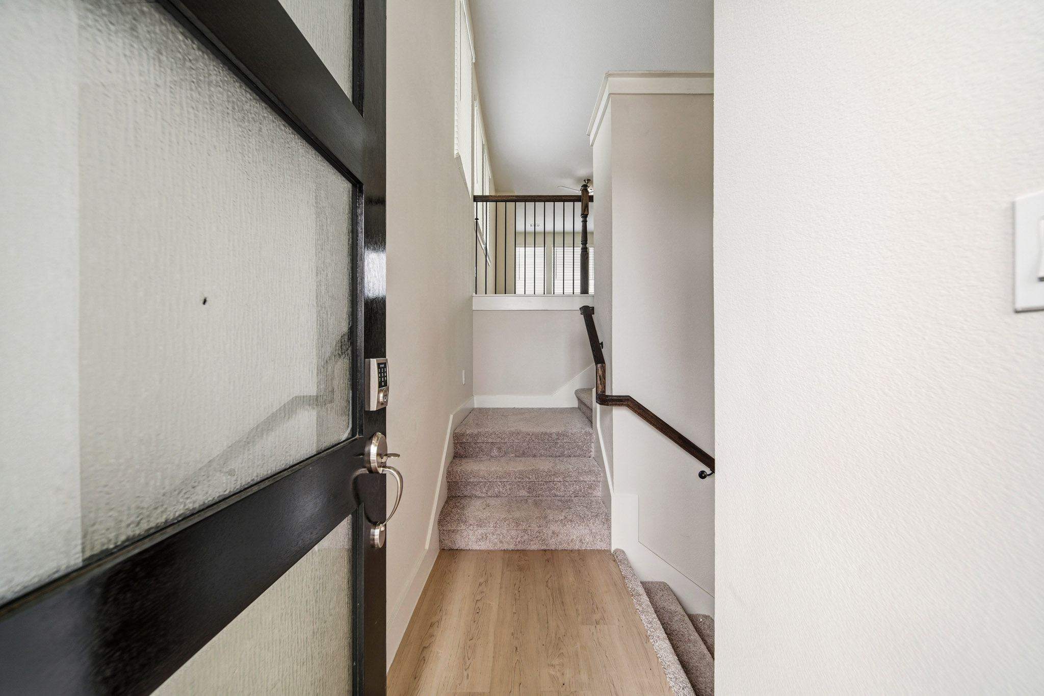 A hallway with a wood floor.