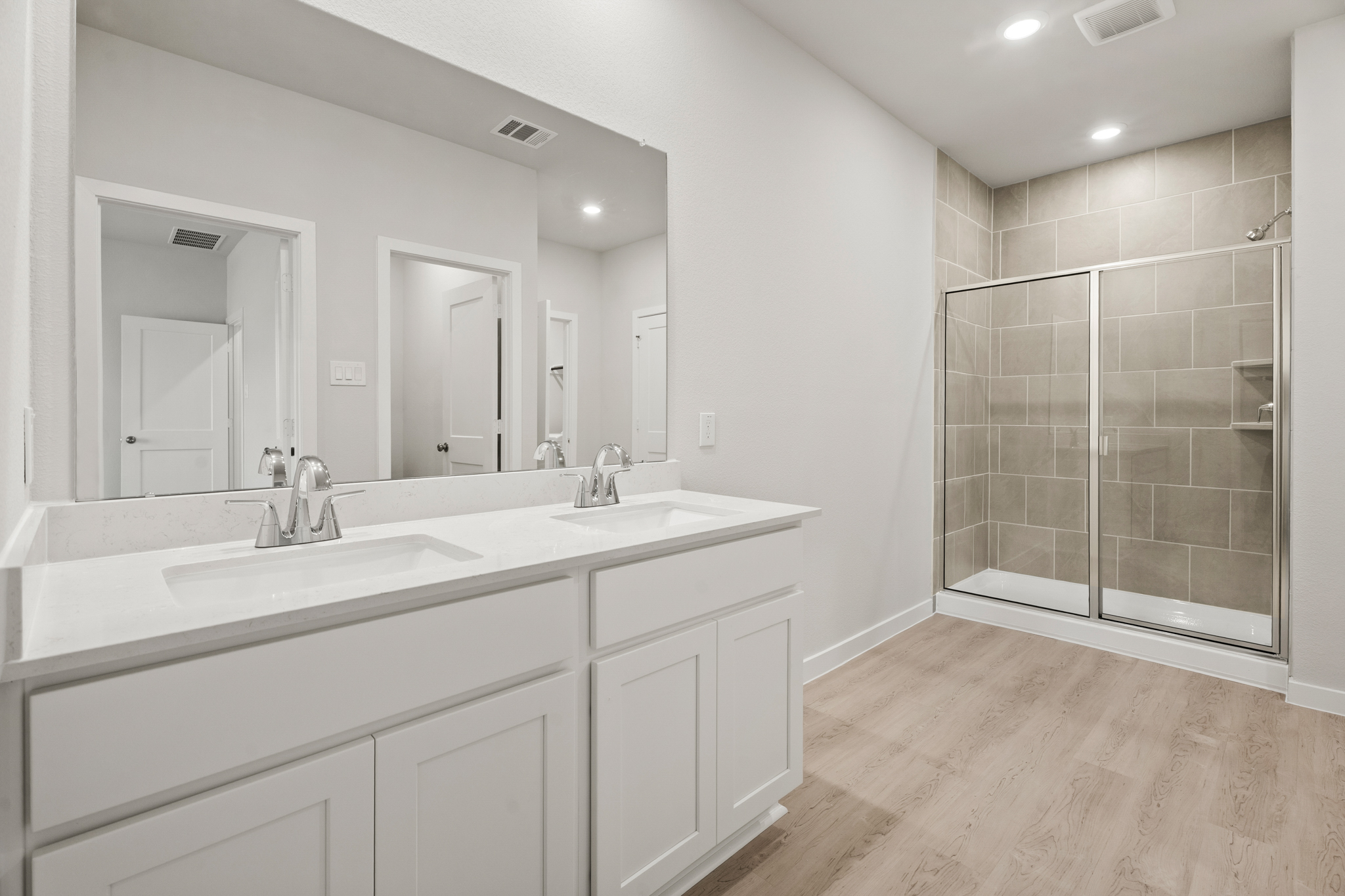 A bathroom with a glass shower.
