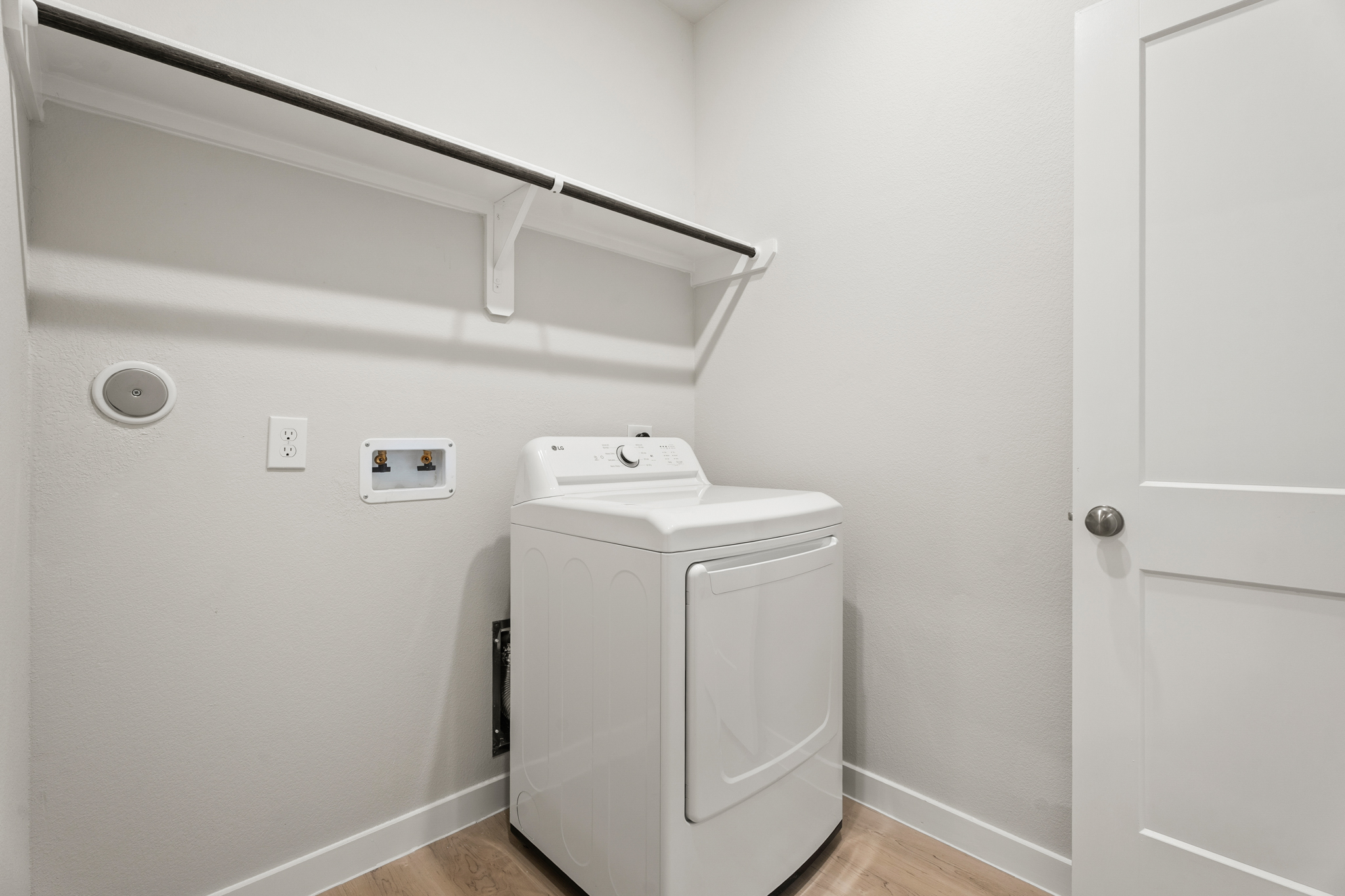 A white washing machine in a room.