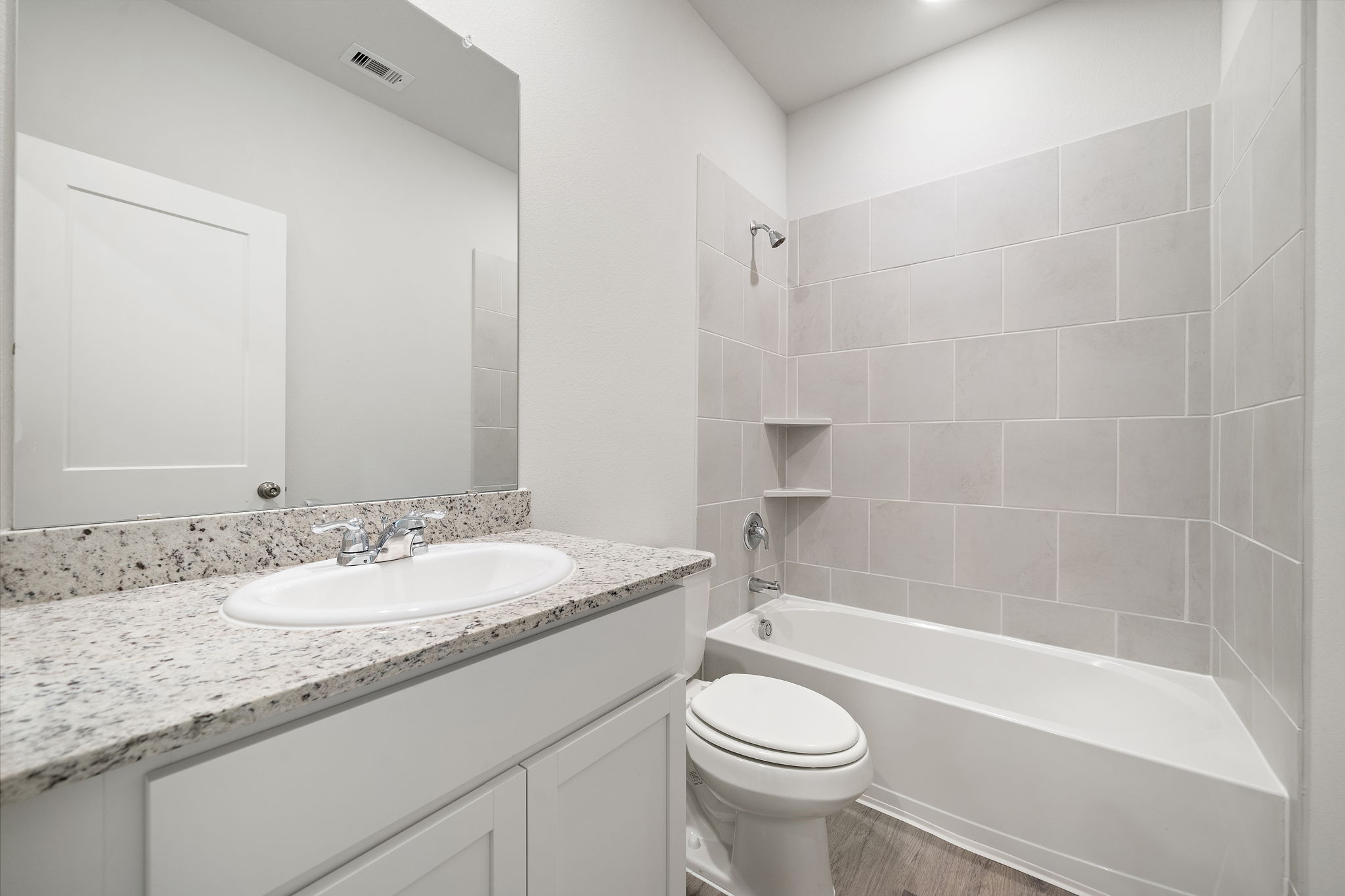 A bathroom with a sink and a toilet.