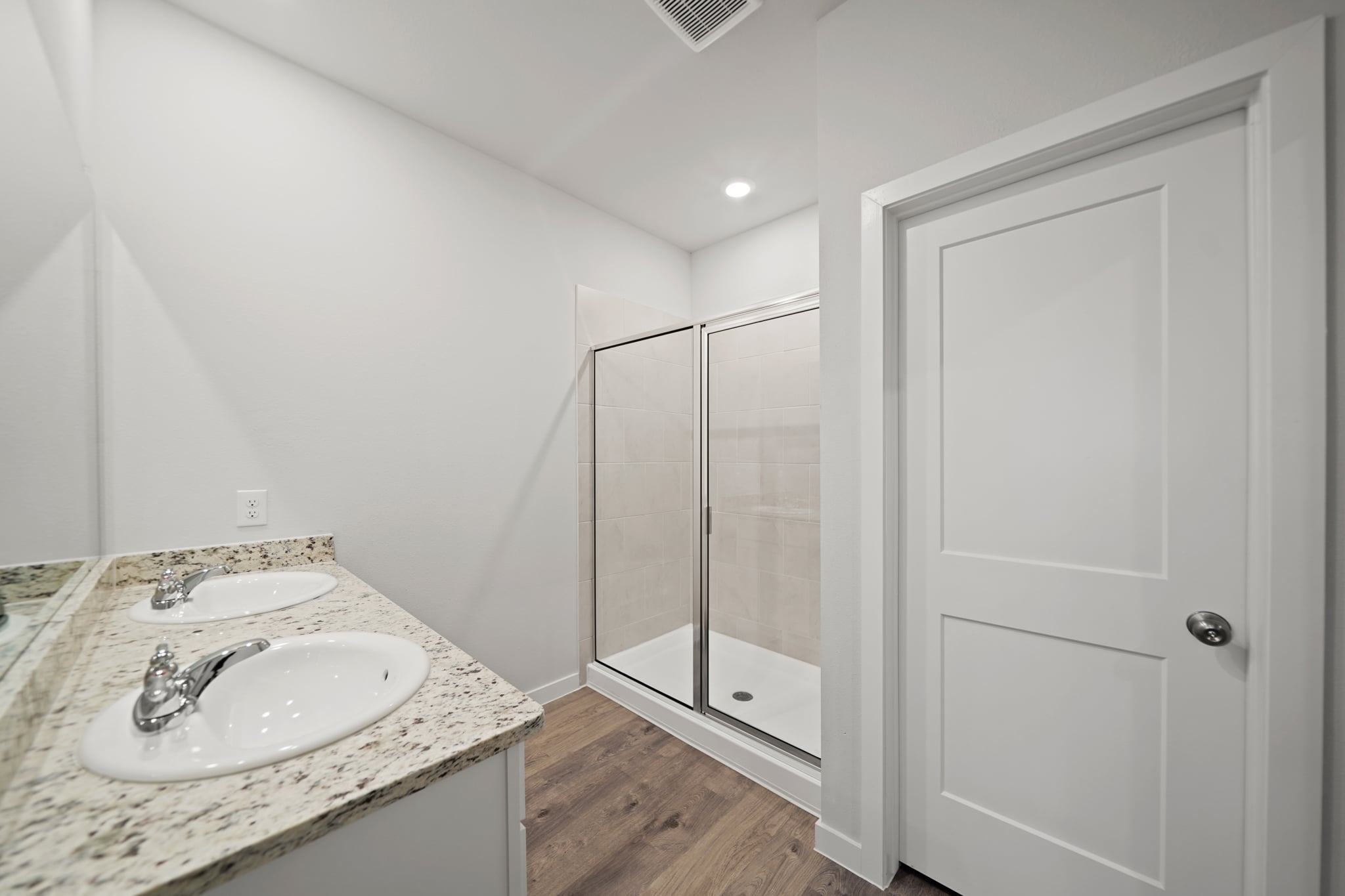 A bathroom with a glass shower.
