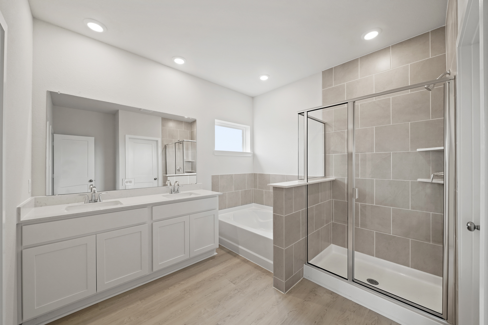 A bathroom with a glass shower.