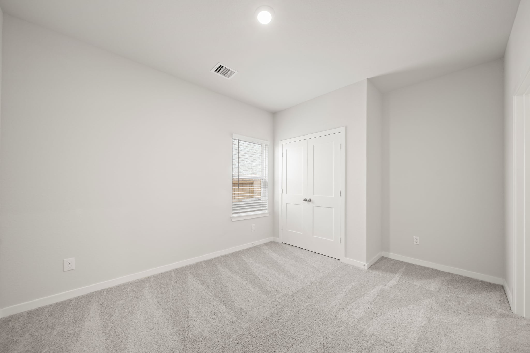 A room with white doors.