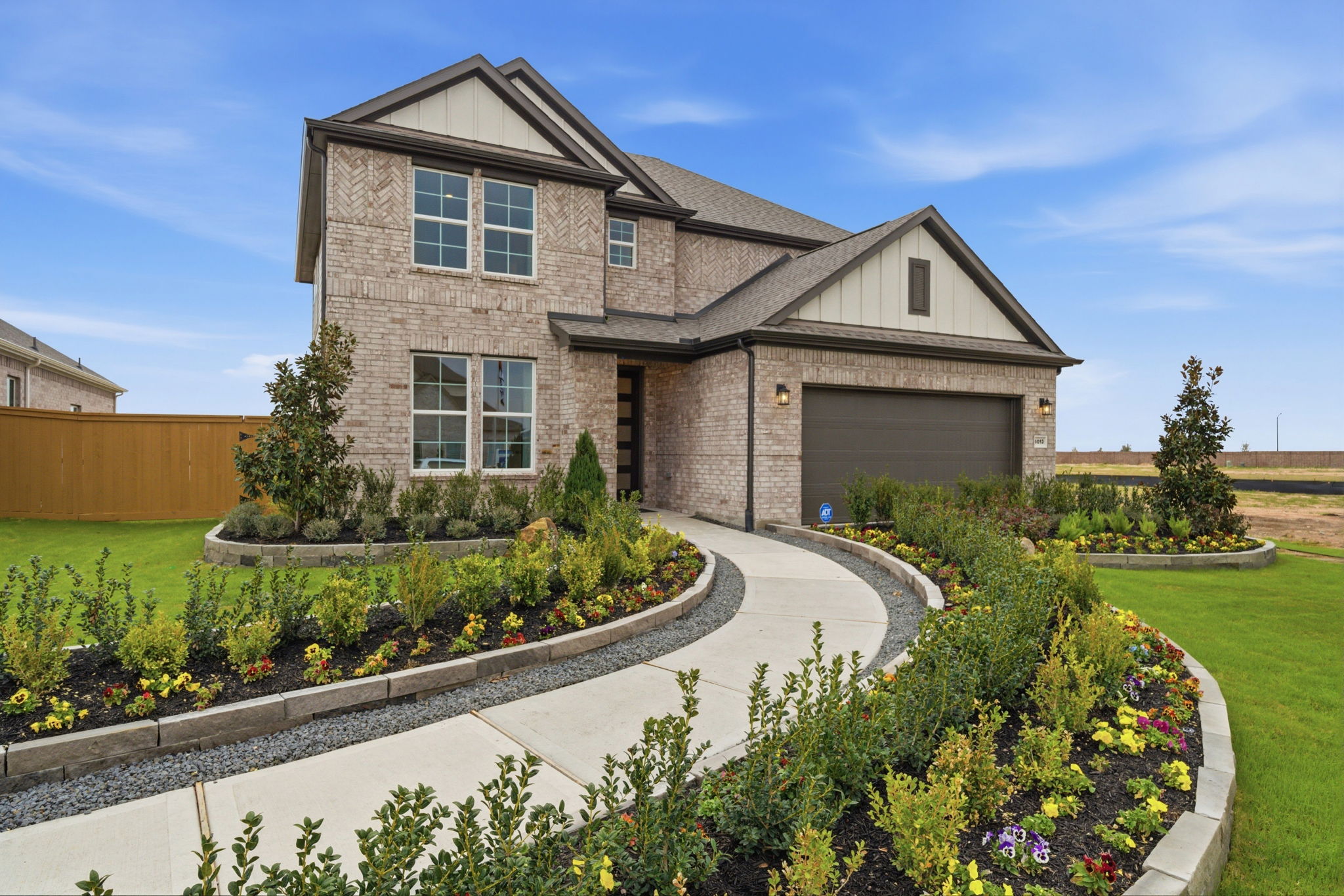 A house with a garden in front.