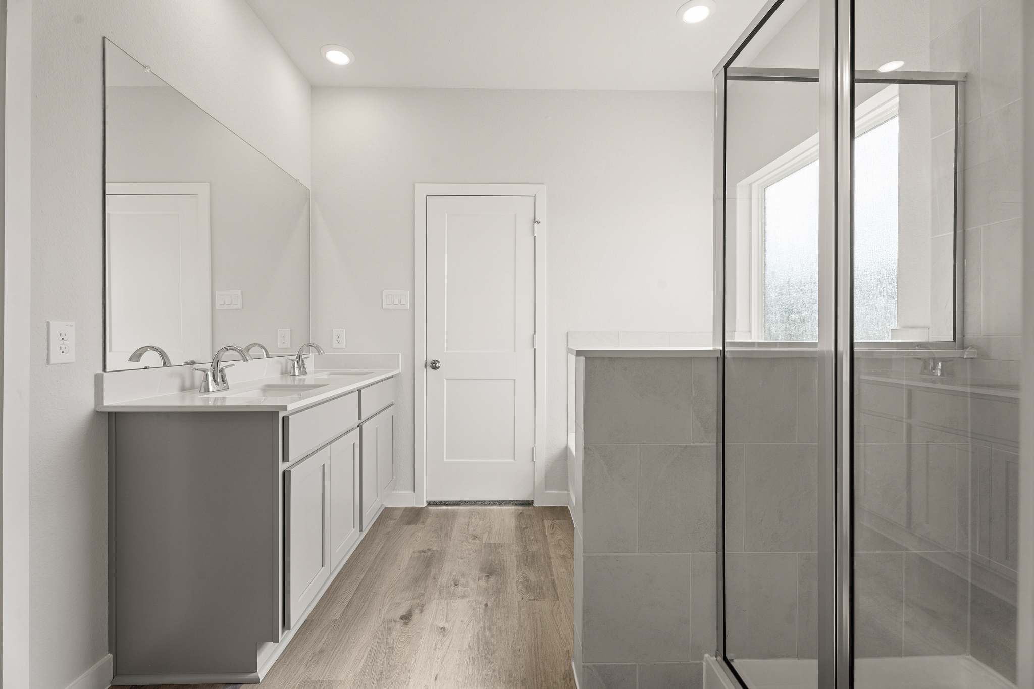 A bathroom with a glass shower.