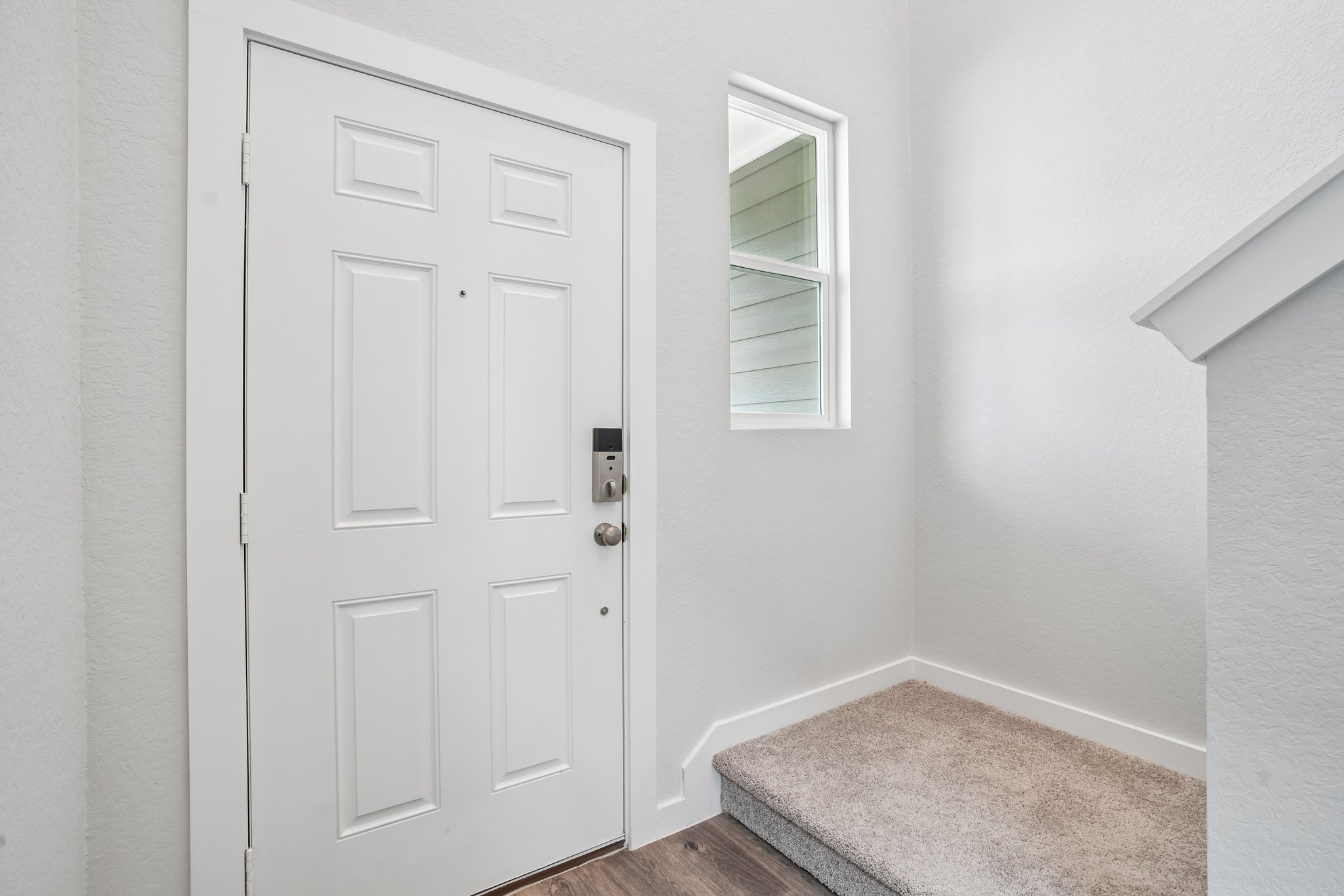 A white door in a room.