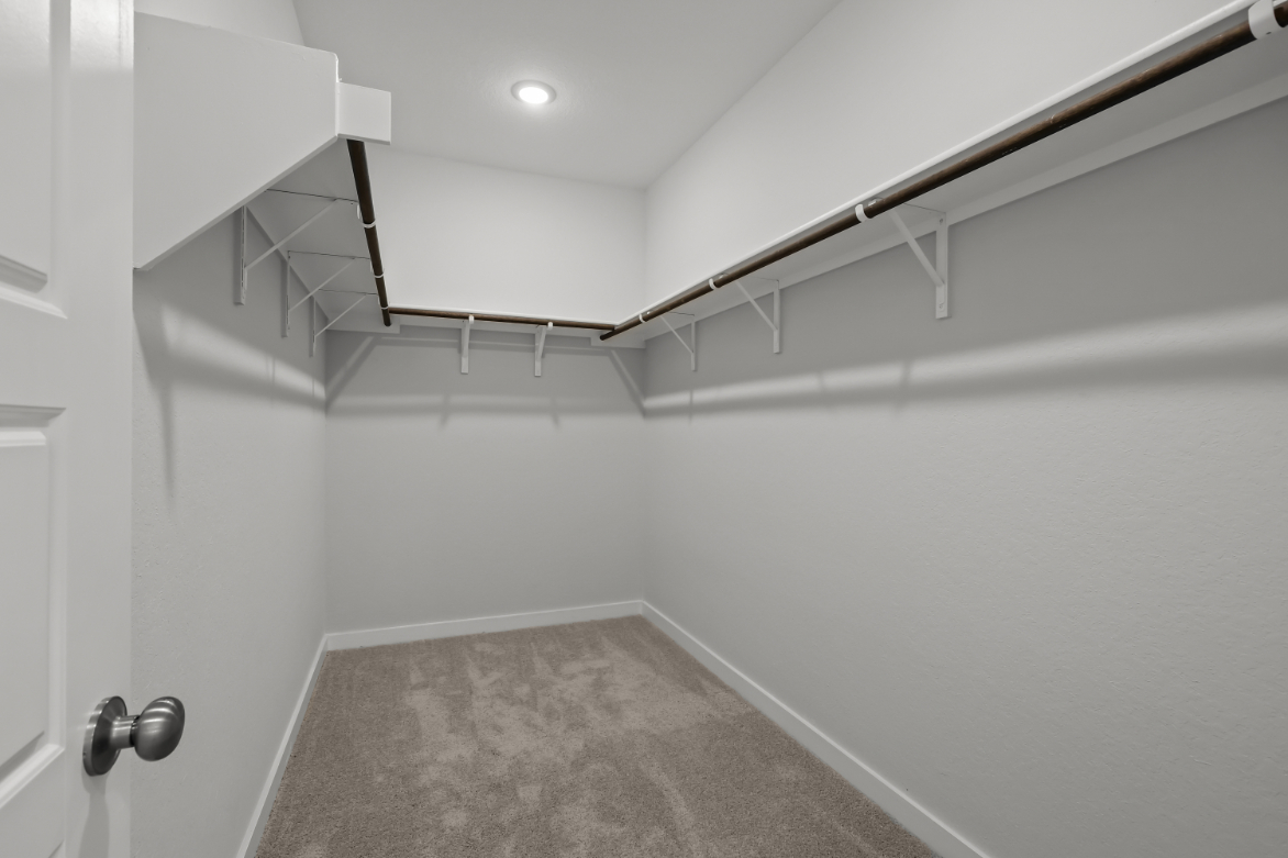 A white staircase in a room.