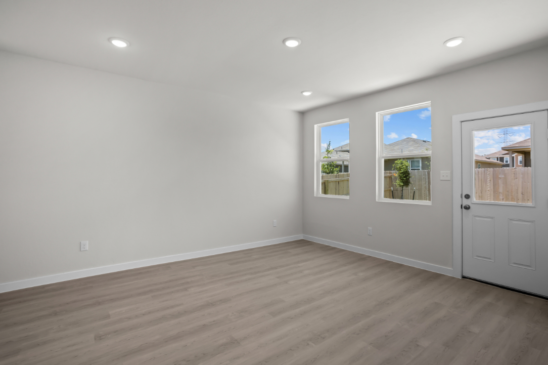 A room with white walls and windows.