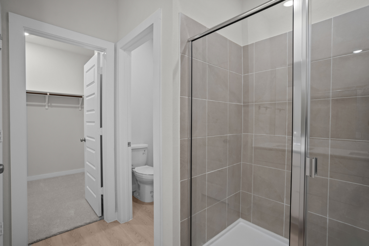 A bathroom with a glass shower.