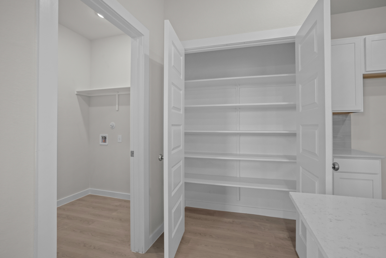 A white room with white cabinets.