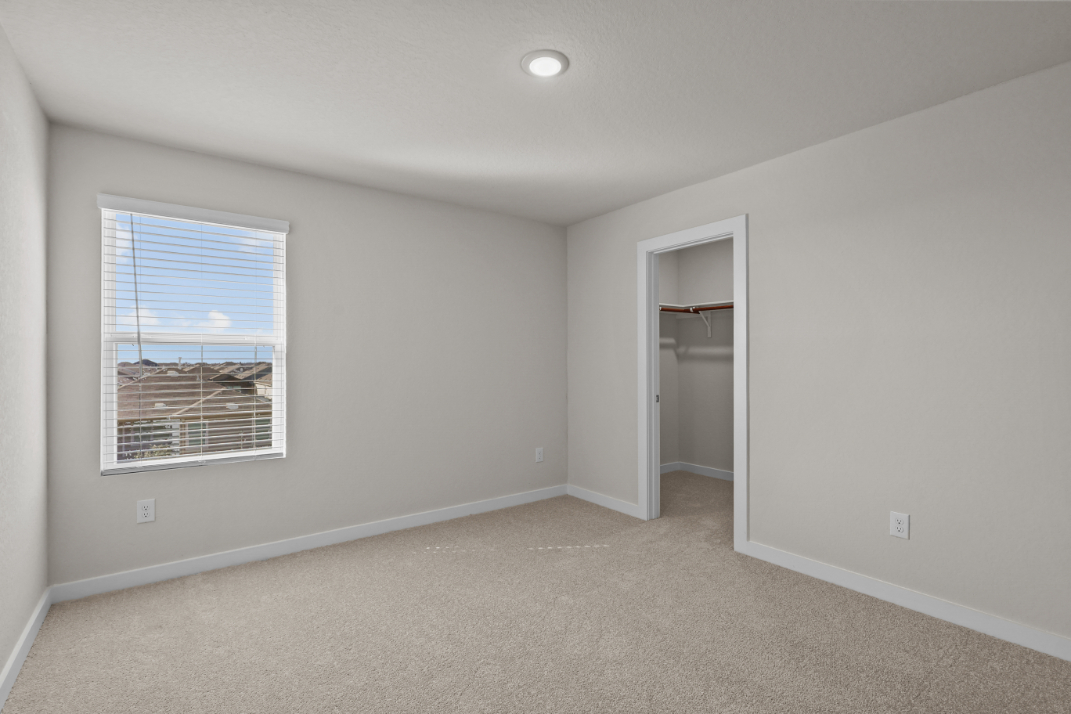 A room with a window and a door.