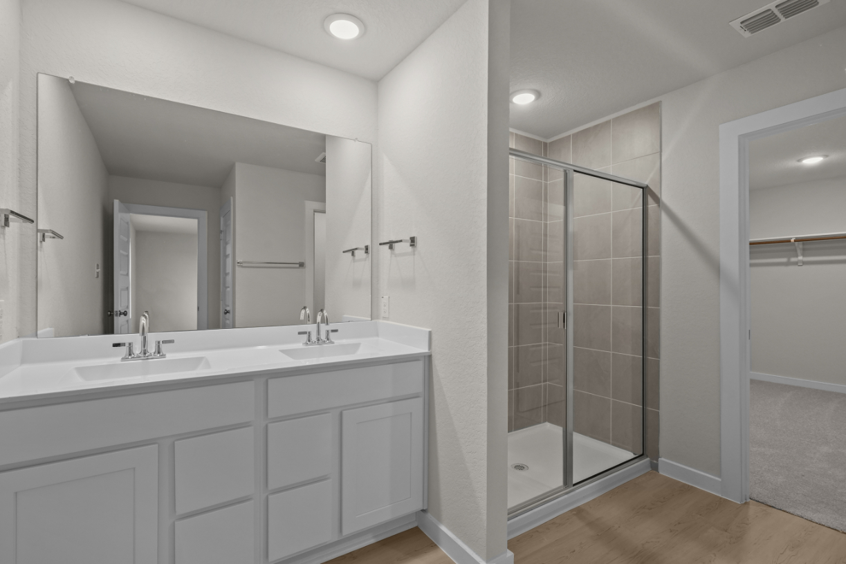 A bathroom with a glass shower.