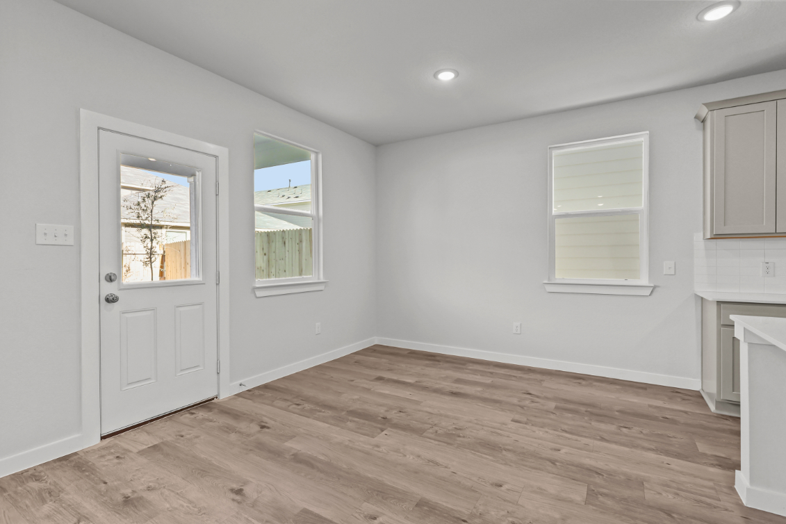 A room with white walls and windows.