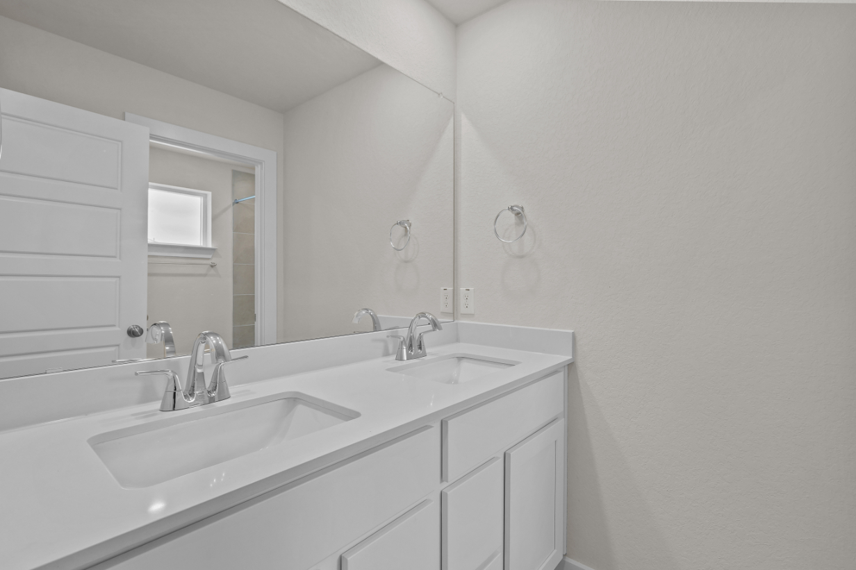 A bathroom with two sinks.