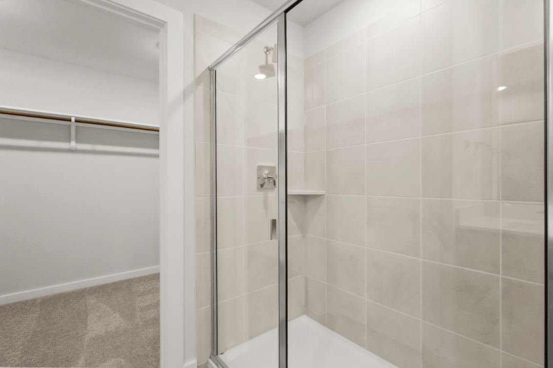 A shower with a glass door.