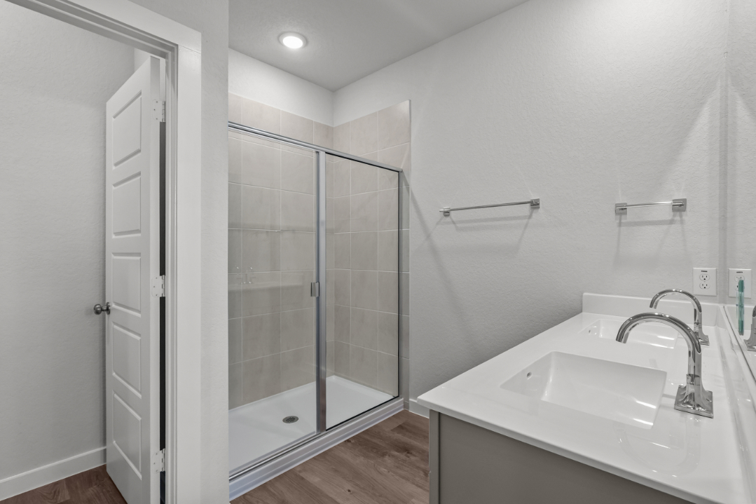 A bathroom with a glass shower.