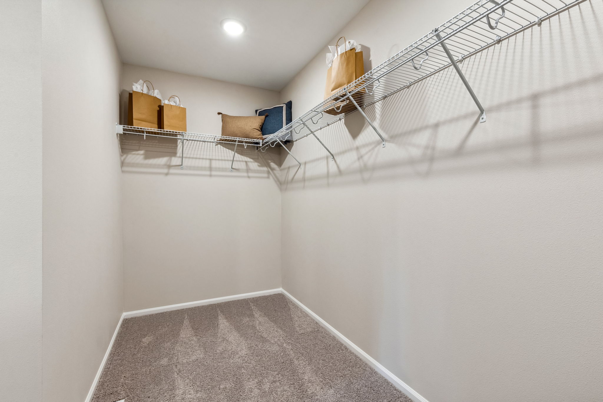 A staircase with a chair and a table.