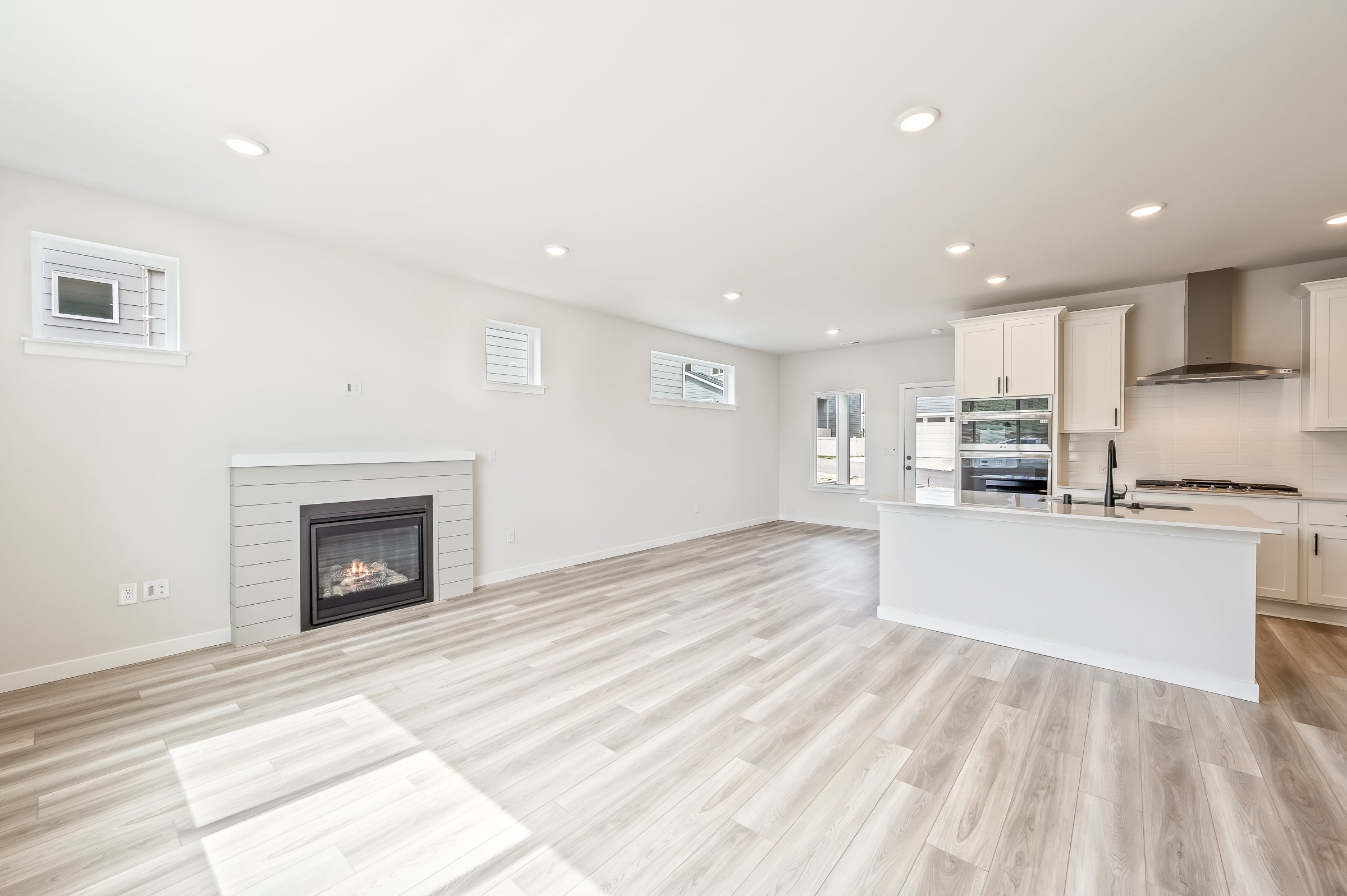 A large kitchen with a fireplace.