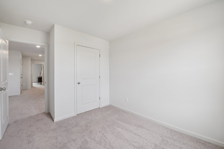 A hallway with white doors.