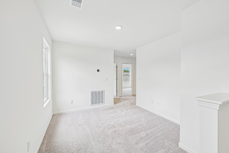 A hallway with white walls.