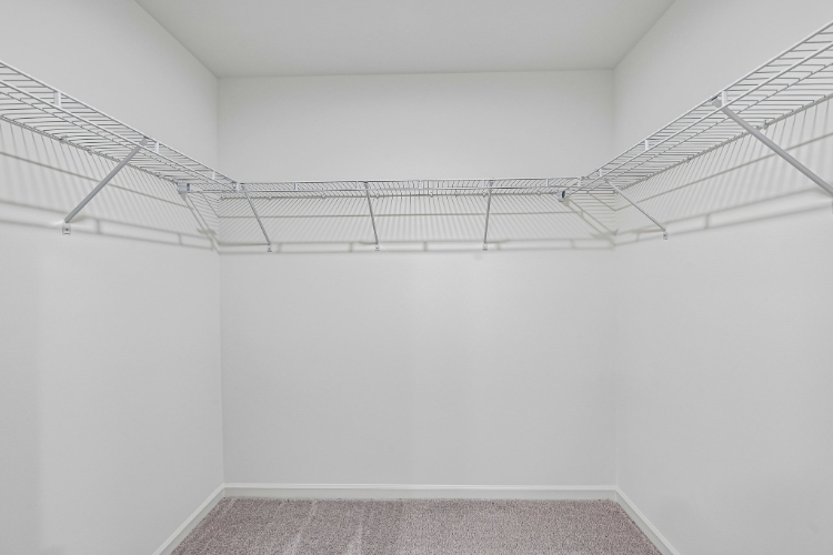 A white room with a staircase.
