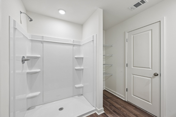 A bathroom with a tub and sink.