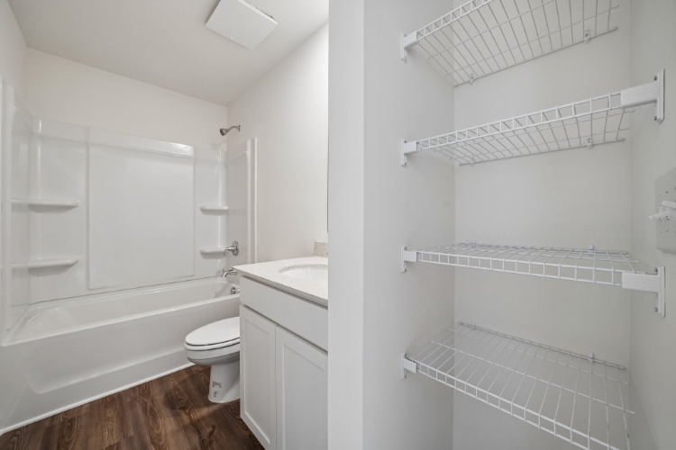 A bathroom with white walls.