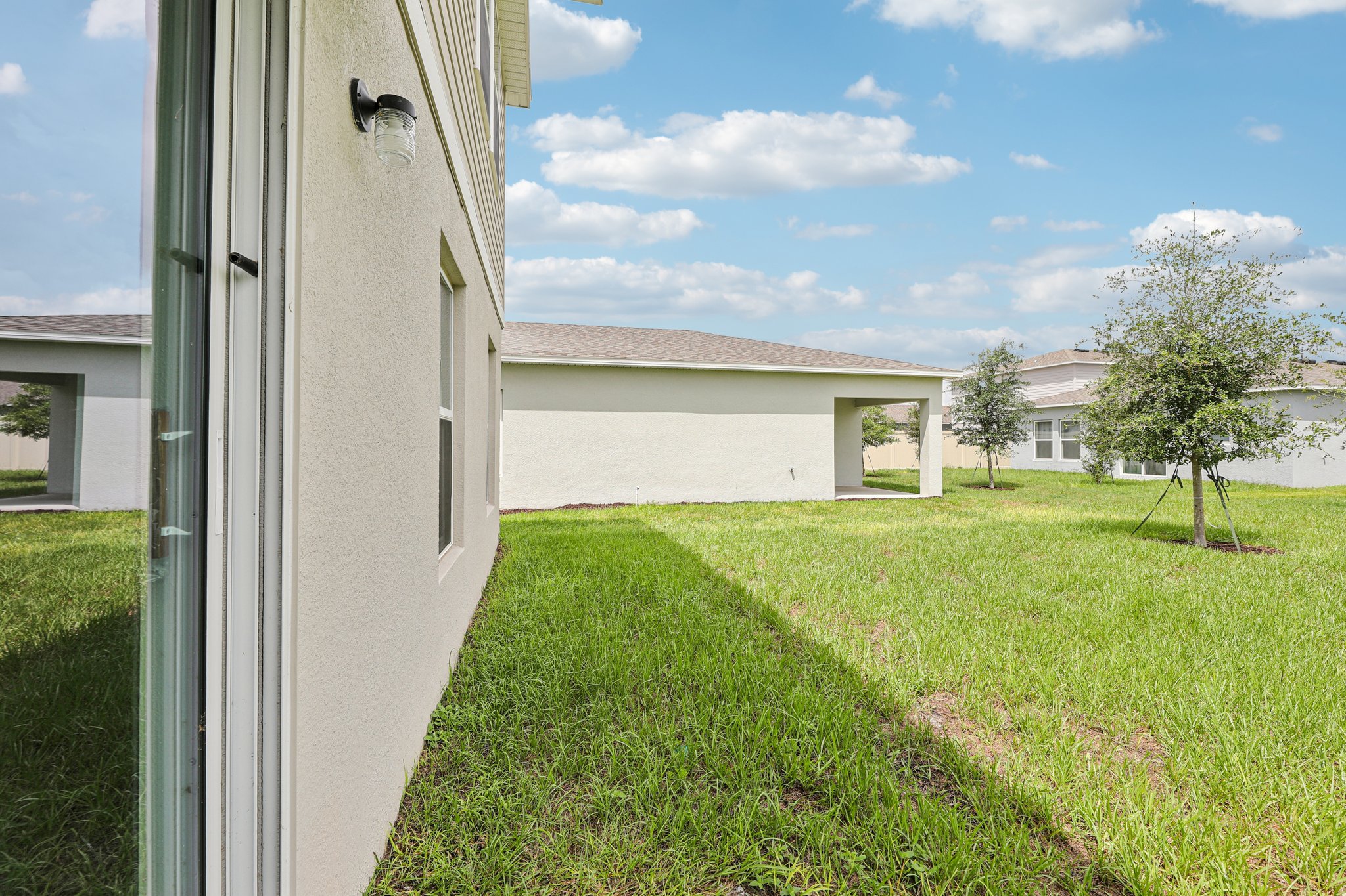 A house with a grass yard.