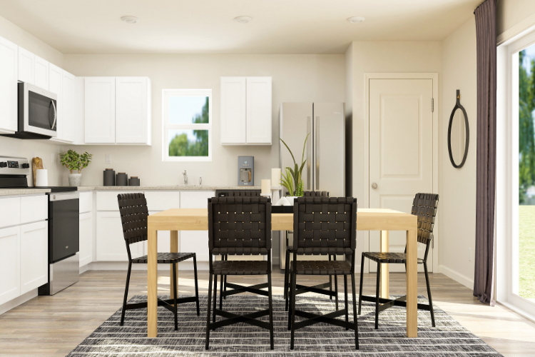 A kitchen with a dining table.