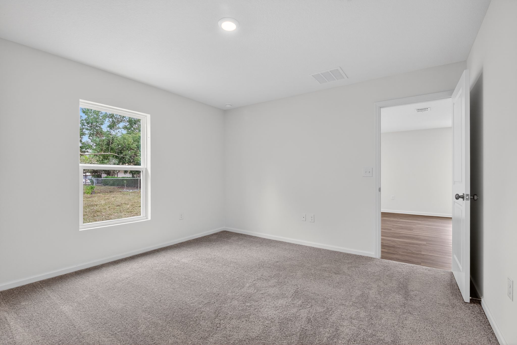 A room with a door and a window.