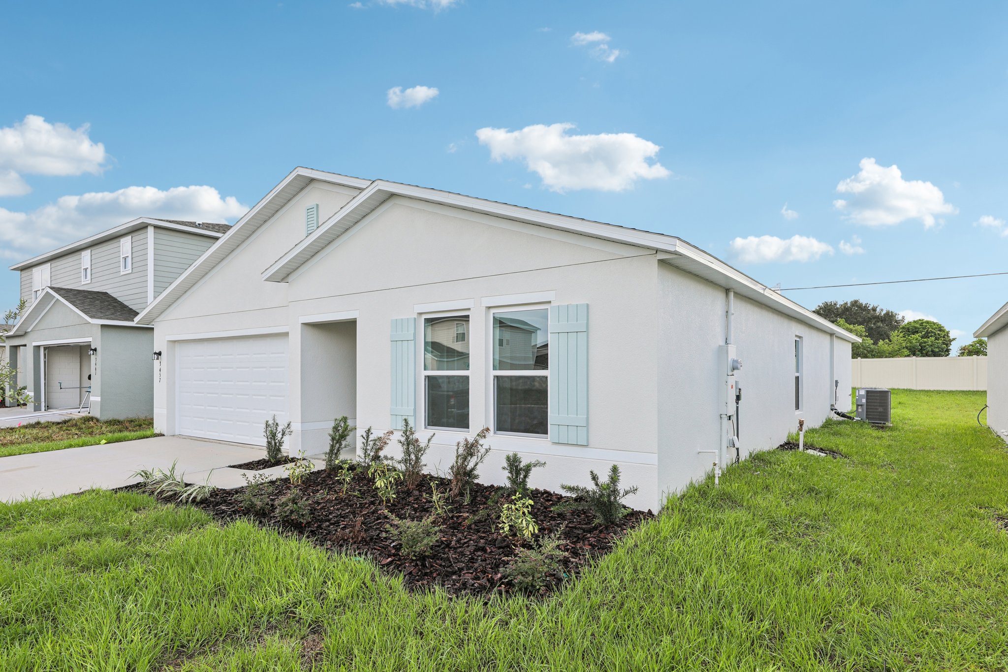 A white house with a blue roof.