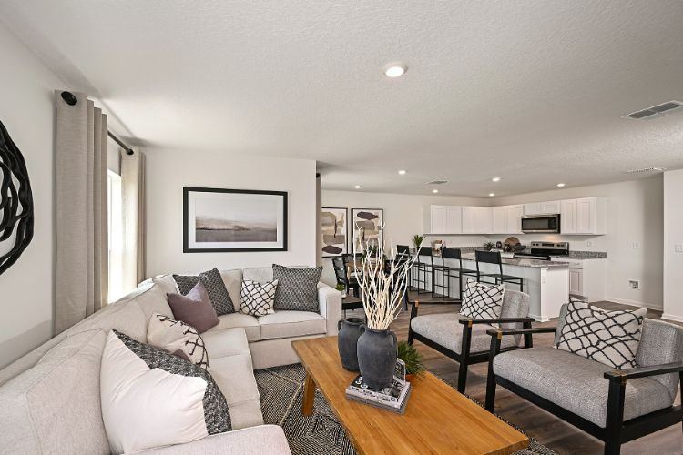 A living room with a couch and a table.