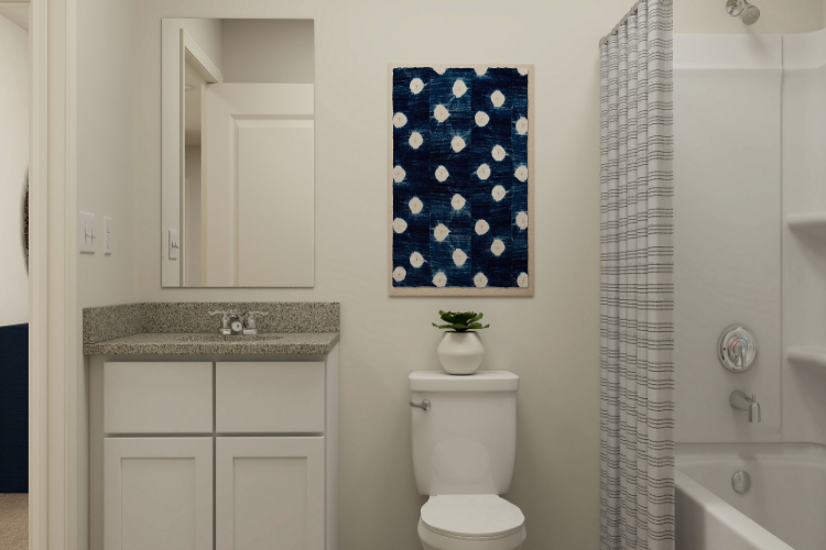 A bathroom with a toilet and sink.